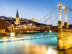 night view from St Georges footbridge in Lyon city with Fourviere cathedral, France; 