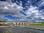 Beaugency Bridge and Dramatic blue skies in Loire department France; 